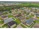 Aerial view of the house showing the nearby amenities, including the pond and greenery at 105 Adoncia Way, Sanford, FL 32771