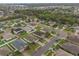 An aerial view showcases a neighborhood with well-maintained homes, green lawns, and mature trees at 105 Adoncia Way, Sanford, FL 32771
