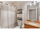Well-maintained bathroom with granite countertop, decorative cabinets, and shower with curtain at 105 Adoncia Way, Sanford, FL 32771