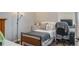 Cozy bedroom featuring a full bed, a nightstand, and a dedicated desk space at 105 Adoncia Way, Sanford, FL 32771