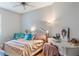 Bright bedroom with a full bed, desk, and stylish decor at 105 Adoncia Way, Sanford, FL 32771