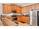 Well-equipped kitchen featuring stainless steel appliances, granite countertops, and ample cabinet space at 105 Adoncia Way, Sanford, FL 32771