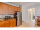 Practical kitchen with stainless steel refrigerator and appliances and ample counter space at 105 Adoncia Way, Sanford, FL 32771
