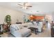 Open-concept living room and kitchen with a large sectional sofa at 105 Adoncia Way, Sanford, FL 32771