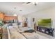 Open-concept living room and kitchen with bar seating at the kitchen counter at 105 Adoncia Way, Sanford, FL 32771