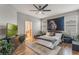 Well-lit bedroom featuring a queen bed and stylish decor at 105 Adoncia Way, Sanford, FL 32771