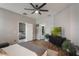 Neutral main bedroom with wood floors and a flat screen television at 105 Adoncia Way, Sanford, FL 32771