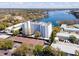 An aerial view of a waterfront condominium with covered parking and lake views at 1100 S Orlando Ave # 301, Maitland, FL 32751