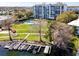 Condo featuring a pool, green spaces, and waterfront access with boat slips at 1100 S Orlando Ave # 301, Maitland, FL 32751