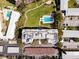 Top-down aerial view of condominium featuring boat docks, pool, green space and parking at 1100 S Orlando Ave # 301, Maitland, FL 32751