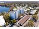 Aerial view of condo complex, surrounding neighborhood and waterfront setting at 1100 S Orlando Ave # 301, Maitland, FL 32751