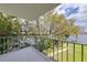 Balcony with views of green trees, community walking path, and a glimpse of the lake at 1100 S Orlando Ave # 301, Maitland, FL 32751