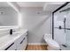 Bathroom showcasing a luxurious vanity and sleek frameless glass shower at 1100 S Orlando Ave # 301, Maitland, FL 32751