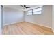 Bright bedroom featuring sleek ceiling fan and attractive wood flooring at 1100 S Orlando Ave # 301, Maitland, FL 32751