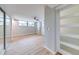 Large bedroom featuring a ceiling fan, sliding doors and wood-look floors at 1100 S Orlando Ave # 301, Maitland, FL 32751