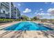 Large community pool with crystal clear water on sunny day at 1100 S Orlando Ave # 301, Maitland, FL 32751