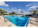 Large sparkling community pool with comfortable poolside lounge chairs overlooking the water at 1100 S Orlando Ave # 301, Maitland, FL 32751