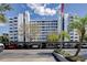 Exterior shot of condo building featuring covered parking, landscaping, and an American flag at 1100 S Orlando Ave # 301, Maitland, FL 32751