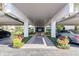 The entrance is adorned with landscaping, leading to the building's interior at 1100 S Orlando Ave # 301, Maitland, FL 32751