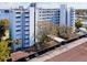 Exterior of complex with assigned covered parking and waterfront views at 1100 S Orlando Ave # 301, Maitland, FL 32751