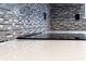 Modern kitchen with elegant backsplash tiles, white countertops, and sleek black appliances at 1100 S Orlando Ave # 301, Maitland, FL 32751