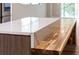 Kitchen island featuring butcher block counter extension and white marble countertop at 1100 S Orlando Ave # 301, Maitland, FL 32751