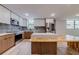 Stylish kitchen with wood and white cabinets, stainless appliances and mosaic backsplash at 1100 S Orlando Ave # 301, Maitland, FL 32751