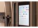 Stainless steel refrigerator with a display featuring a variety of installed apps at 1100 S Orlando Ave # 301, Maitland, FL 32751
