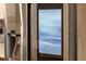 Stainless steel refrigerator with touchscreen display showing internal temperature and date at 1100 S Orlando Ave # 301, Maitland, FL 32751