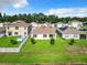 Expansive community view with manicured lawns, homes with neutral exteriors and fenced yards, some with private pools at 1133 August Sky Dr, Deltona, FL 32738