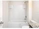 Bathroom features white tub, shower, grab bars and toilet at 1133 August Sky Dr, Deltona, FL 32738