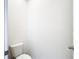 Clean half bathroom with a white toilet and neutral walls at 1133 August Sky Dr, Deltona, FL 32738