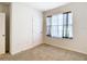 Bedroom with carpet, natural light from window, and door with knob at 1133 August Sky Dr, Deltona, FL 32738