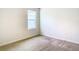 Bedroom with a window, carpet, neutral walls, and electrical outlets at 1133 August Sky Dr, Deltona, FL 32738