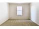 Bedroom features carpet, neutral walls, and a large window with natural light at 1133 August Sky Dr, Deltona, FL 32738