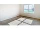 Bright bedroom with a large window overlooking a pond with neutral carpeting illuminated by sunlight at 1133 August Sky Dr, Deltona, FL 32738