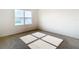Bright bedroom with a large window overlooking a pond and neutral carpeting illuminated by sunlight at 1133 August Sky Dr, Deltona, FL 32738