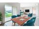 Bright dining area with a view of the lake, seamlessly connecting to the cozy living room at 1133 August Sky Dr, Deltona, FL 32738