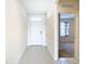 Inviting foyer with a white front door and tile flooring, creating a clean and open entrance at 1133 August Sky Dr, Deltona, FL 32738