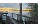 View of the lake from the dock, showcasing the sunset and natural beauty at 1180 Killaloe Ter, Chuluota, FL 32766