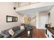 Spacious living room featuring a staircase to the second story and hardwood floors at 1180 Killaloe Ter, Chuluota, FL 32766