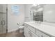 Bathroom featuring a quartz countertop vanity, tile flooring, shower with glass door and neutral-toned accent tiles at 1222 Shorecrest Cir, Clermont, FL 34711