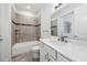 Bright bathroom featuring a tiled shower-over-tub, white vanity with a quartz countertop, and chrome fixtures at 1222 Shorecrest Cir, Clermont, FL 34711