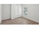 Bedroom with wood-look tile flooring and a closet at 1222 Shorecrest Cir, Clermont, FL 34711