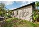 Exterior view of the home showing the siding, lawn, and landscaping at 1222 Shorecrest Cir, Clermont, FL 34711