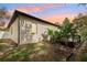 Exterior view of the home showing the siding, lawn, and landscaping at 1222 Shorecrest Cir, Clermont, FL 34711