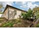 Exterior view of the home showing the siding, lawn, and landscaping at 1222 Shorecrest Cir, Clermont, FL 34711
