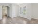 Inviting foyer with decorative glass doors and neutral tile flooring at 1222 Shorecrest Cir, Clermont, FL 34711
