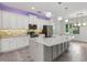 Bright kitchen with a granite island, stainless steel appliances, and pendant lighting at 1222 Shorecrest Cir, Clermont, FL 34711