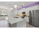 Bright kitchen with stainless steel appliances, granite countertops, a large island, and pendant lighting at 1222 Shorecrest Cir, Clermont, FL 34711